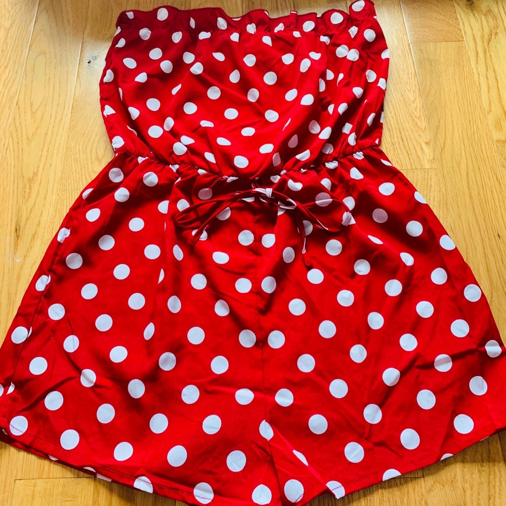 This is a red and white polka romper